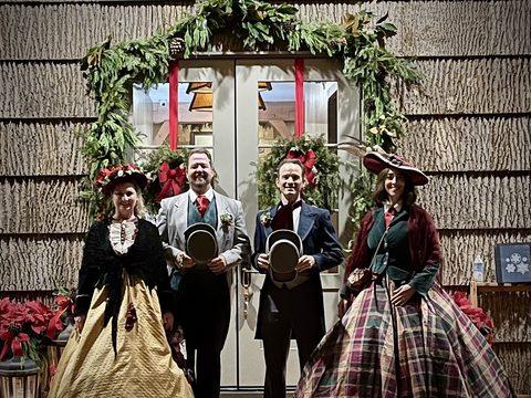 Collins Classic Carolers quartet at a doorway