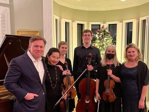 String quartet performing in a private home